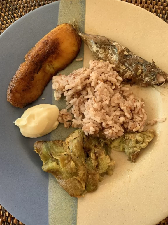 Healthy combination of fish, egg, and eggplant, with fried banana on the side from MIH.